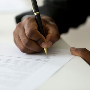 hand signing legal document